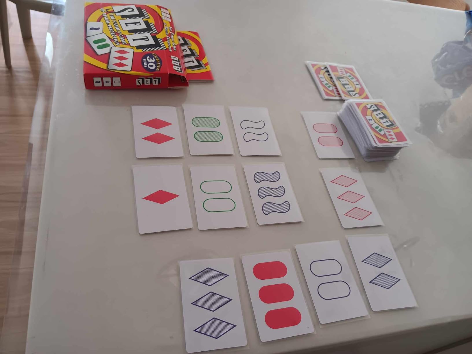 SET Enterprises SET - The Family Card Game of Visual Perception - Race to Find The Matches, For Ages 8+, 81 Cards, Rules included customer photo 1