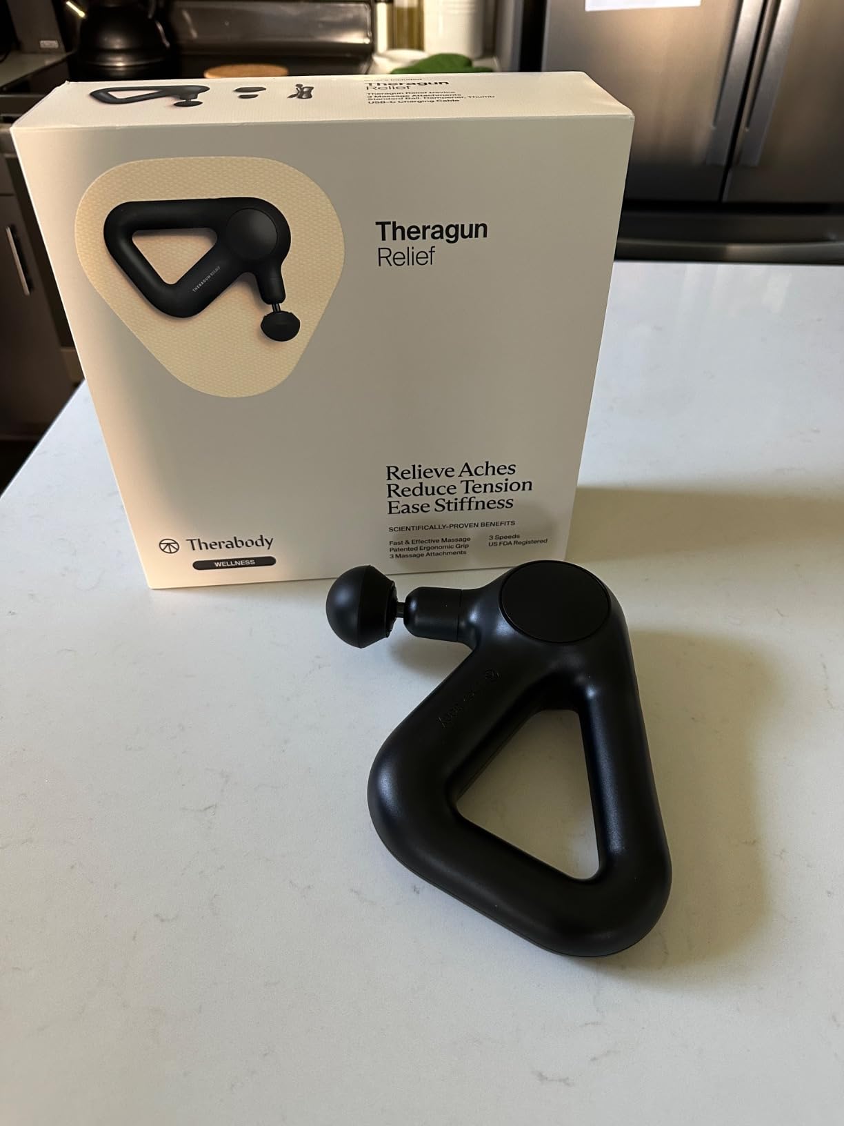TheraGun Therabody Relief Massage Gun | for Daily Comfort | 3-Speed | Black | Quiet Handheld Percussion Muscle Massager for Back, Leg & Shoulder Pain Relief. Lightweight, Easy to Use, Ergonomic Grip customer photo 2